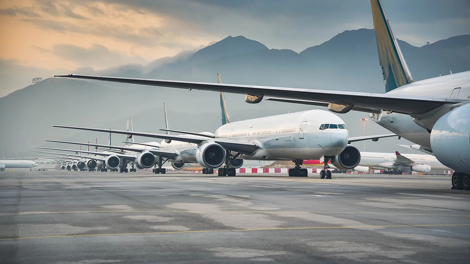 airline fleet parked at the taxiway of Airport