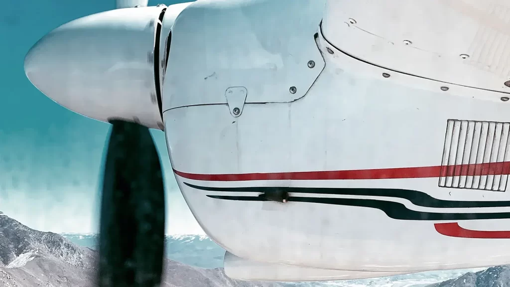 Close up shot of a small aircraft's propellor in flight.
