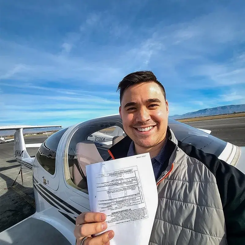 Pilot proudly displaying his certification